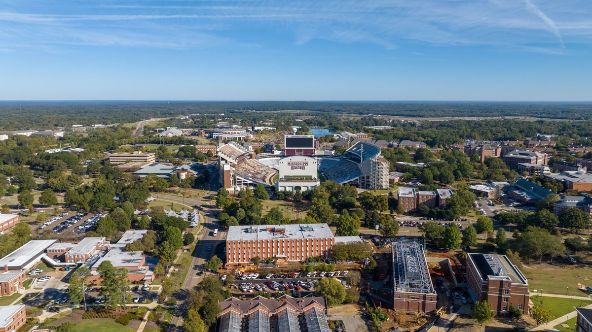 Drone aerial shot of Mississippi State University campus with Davis Wade Stadium at center
