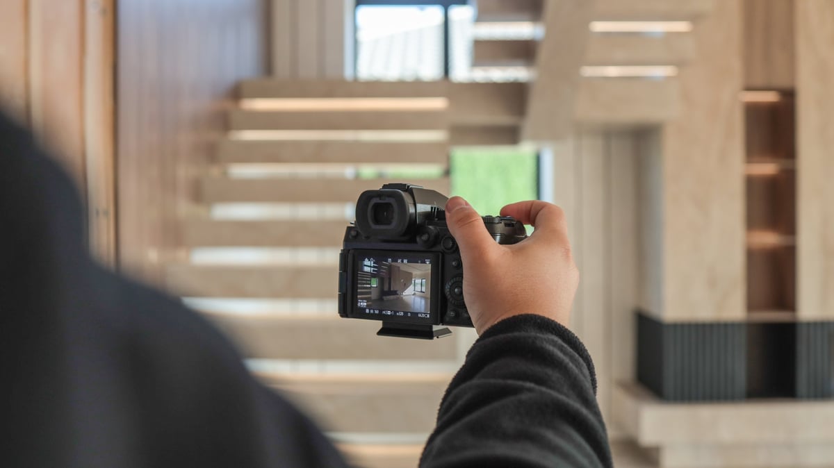 Photographer capturing architectural design with professional camera
